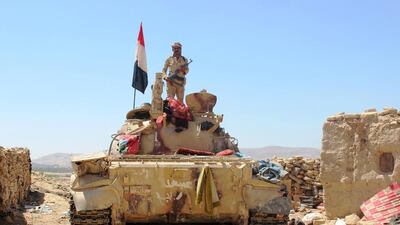 A Yemeni soldier stands on a tank stationed near Marib's old city on October 16, 2015. Angus McDowall/Reuters