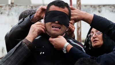 The mother removes the noose with the help of her husband from around the neck of Balal.