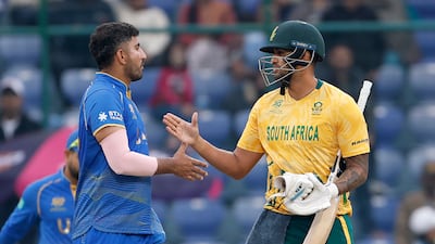 UAE's Junaid Siddique congratulates Jason Smith after South Africa's victory in their T20 World Cup match in Delhi. Getty Images