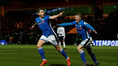 A month ago, Steven Davies, left, and Rochdale were celebrating a famous FA Cup result against Tottenham. The League One club are now back to the day job, fighting to prevent relegation to. Rochdale are second-bottom, six points from safety, although they have at least two games in hand on the sides above them. Andrew Yates / Reuters