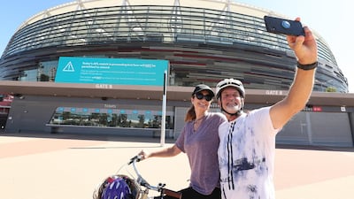 A couple takes a selfie in front of Optus Stadium in Perth. Getty Images