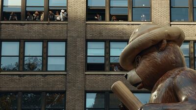 The Smokey Bear Balloon moves through Sixth Avenue. AP Photo