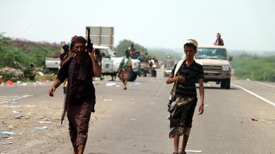 Yemeni government forces backed by the Saudi-led coalition take position at an area after seizing it from the Houthi militia in the western province of Hodeidah. Stringer / EPA