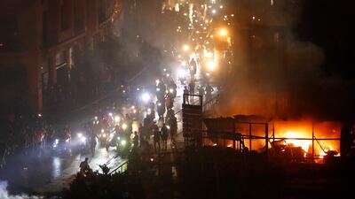 Protesters arrive on two-wheelers at a square near the government palace in Beirut. AP Photo