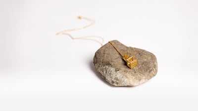 Jewellery designed by Alia bin Omair. The artisans of Irthi's Bidwa Social Develpoment Programme executed the designs using Emirati Safeefah weaving techniques to achieve the texture on the piece. Courtesy Irthi