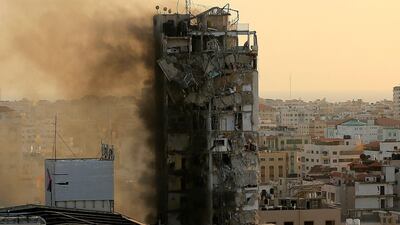 An air guided bomb hits Al-Shorouk tower, which collapses. AFP