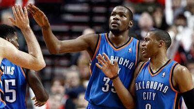 Kevin Durant and Russell Westbrook celebrate with teammates.