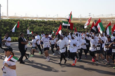 ABU DHABI, UNITED ARAB EMIRATES - APRIL 18: Thousands of people from different age groups took part in the 'Hassantak Ya Watan' (We Protected You, O Homeland) run held in Abu Dhabi, United Arab Emirates on April 18, 2026. The 5-kilometer race, organized at Wahat Al Karama, aimed to strengthen solidarity in the country amid the impacts of the US-Iran conflict. Samah Zidan / Anadolu (Photo by Samah Zidan / Anadolu via AFP)