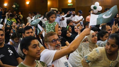 Guests wave the Pakistani flag. Photo: Pakistan Association Dubai