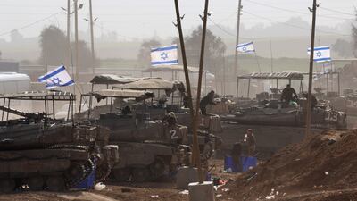 Israeli tanks stand along the southern part of the border with the Gaza Strip near Khan Younis. EPA