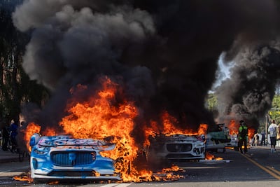 Self-driving cars were set on fire. AFP