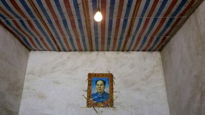 A portrait of China’s late Chairman Mao Zedong is seen at Gong Zhaoyuan’s home at Heshan village, in Shimen county. Jason Lee / Reuters
