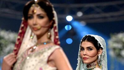 Models present creations of designer Sana Abbas. Rizwan Tabassum / AFP photo