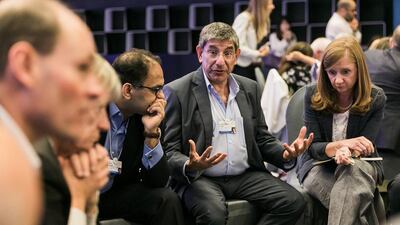 A participant discusses a point in one of the brainstorming sessions at the World Economic Forum's Summit on the Global Agenda that is being held in Abu Dhabi. Courtesy World Economic Forum