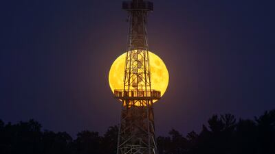 The supermoon rises behind the lookout tower at Csonakazo Lake in Nagykanizsa, Hungary. EPA