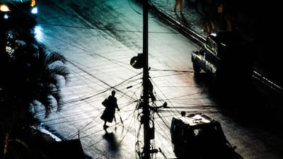 A woman walks on the road after a heavy rainfall in the commune of Petion-Ville, in the Haitian capital Port-au-Prince. AFP