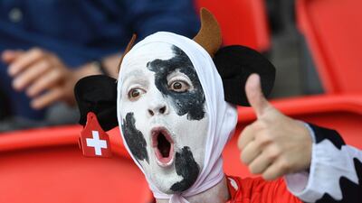 A Swiss football supporter reacts during a Euro 2016 match between Romania and Switzerland at the Parc des Princes stadium in Paris. Miguel Medina / AFP Photo
