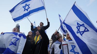Members of the Jewish community attend a rally in Trafalgar Square in London. PA