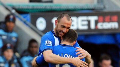 Wigan Athletic's Ivan Ramis celebrates scoring against West Ham United with teammate Shaun Maloney. Anna Gowthorpe/PA