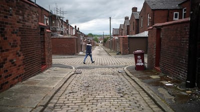 A back alley in Bolton, where surge testing and rapid coronavirus vaccinations continue. The UK government amended earlier advice asking people to avoid non-essential travel to and from Bolton, in the north, and seven other places in England experiencing a surge in Covid-19 case numbers. New guidance asks that people minimise travel to such places, whose local authorities were surprised by the initial rule change, published without fanfare on a government website on May 14. Getty Images