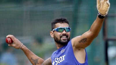 India cricketer Murali Vijay prepares to throw the ball on the last day of team’s six day training camp at National Cricket Academy in Bangalore, India, Monday, July 4, 2016. Aijaz Rahi / AP Photo