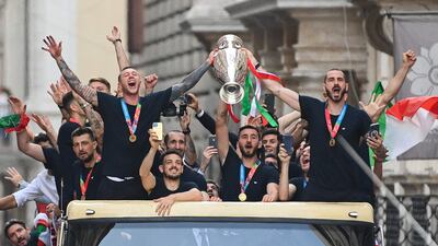 Italy's national football team parade with the UEFA EURO 2020 trophy on a double decker bus in Rome, following their defeat of England in the final match.
