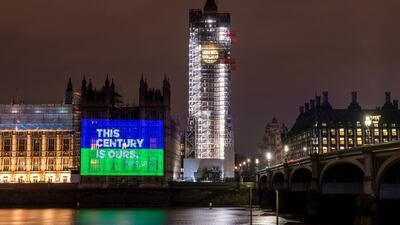 Women's Equality Party slogans projected onto the side of the Houses of Parliament, London, to mark the centenary of women getting the vote in Britain. Chris Ratcliffe / Getty