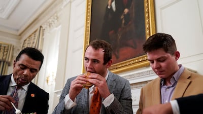 Clemson footballers tuck in. Reuters