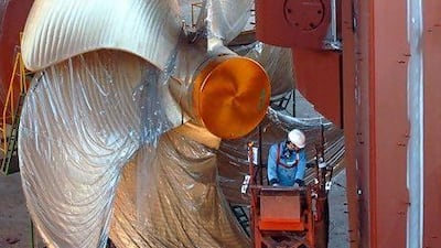A ship under construction at a yard in Ulsan exemplifies South Korea's strategy for integrating the country into the world market. Seokyong Lee for The National