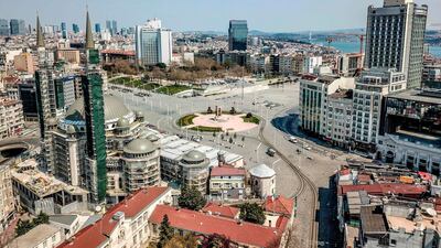 Taksim square in Istanbul is almost deserted on April 11, 2020 amid a 48-hour lockdown imposed the government to prevent the spread of Covid-19 infections. AFP