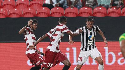 Manuel Lanzini, right, shown here playing with Al Jazira in 2014, takes on two Al Fujairah defenders in their AGL match. Lanzini just signed permanent deal at West Ham United. Jeffrey E Biteng / The National