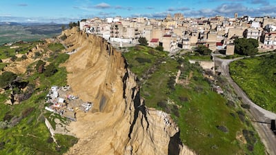 Houses perched along the edge of a cliff after a landslide in Niscemi, Sicily, Italy. Reuters