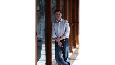 Alexander McNabb, the blogger, author and radio presenter, poses during an interview in Dubai.