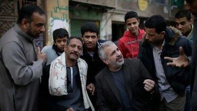 Anthony Shadid, middle right, interviews residents of Embaba, a lower-class Cairo neighborhood, during the Egyptian revolution. AP Photo