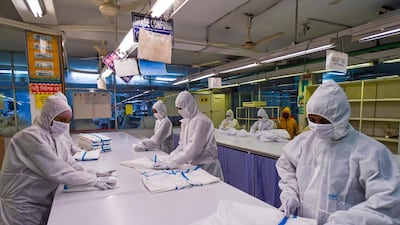 Labourers from Beximco Textiles Ltd work on Personal Protective Equipment in Savar on the outskirts of Dhaka, Bangladesh. AFP