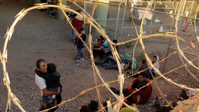 Migrants from Central America wait inside of an enclosure, where they are being held by US Customs and Border Protection in El Paso, Texas. Reuters