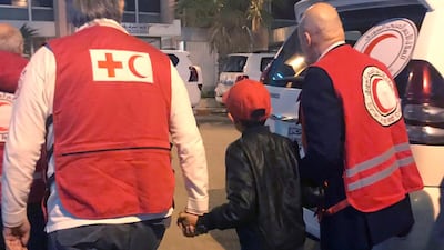 Alvin is accompanied to Damascus airport by Red Cross and Red Crescent officials on Wednesday. AP