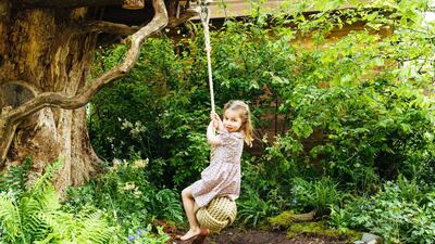 Four-year-old Princess Charlotte plays on the swing in the garden. Matt Porteous / Kensington Palace via Getty Images