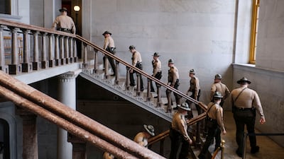 State troopers climb the steps of the Nashville capitol’s rotunda before the start of a legislative session, in Tennessee. Reuters
