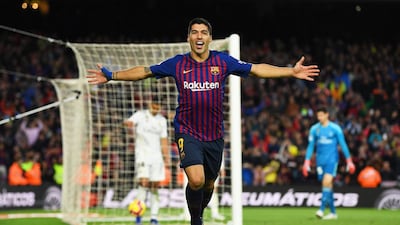 Luis Suarez of Barcelona celebrates scoring his sides fourth goal and completes his hat trick during the La Liga match between FC Barcelona and Real Madrid CF at Camp Nou in Barcelona, Spain. Getty Images