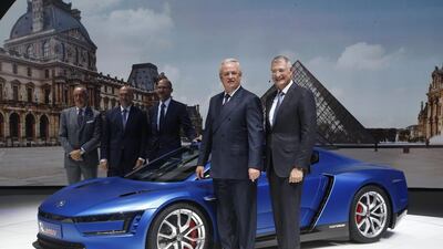 CEO of Volkswagen Martin Winterkorn, left, and engineering chief Heinz-Jakob Neusser , right, pose next to a VW XL at the Motor Show in Paris. Michel Euler / AP Photo