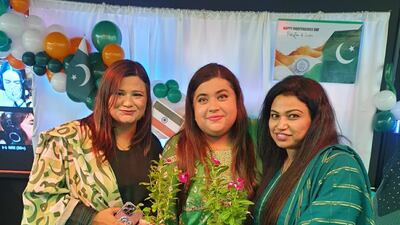 Ayesha Sohail, centre, founder of the UAE Fusion Socialites Global Facebook group, and guests at an event for Pakistan Independence Day. Photo: Ayesha Sohail