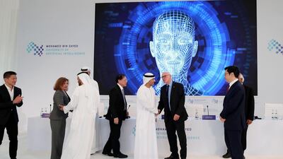 Dignatories gather below a screen at the launch of Mohamed bin Zayed University of Artificial intelligence in Abu Dhabi on October 16. Chris Whiteoak / The National
