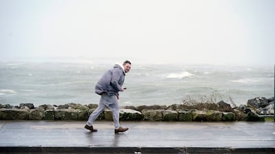 A man walking in high winds at Salthill, Ireland. AP