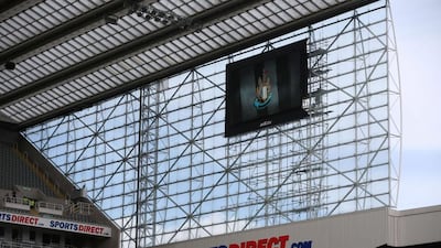 A giant TV screen hanging on the John Hall stand at St James' Park, deemed to be unsafe, delays the start of Newcastle United's match against Leicester City by an hour on Saturday. Ian MacNicol / AFP