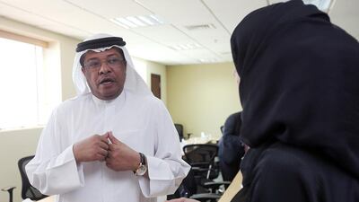 Naji Al Hai, undersecretary at Ministry of Social Affairs, talks to the FNC member Afra Al Basti during the FNC Human Rights committee field visit to the ministry in Dubai. Satish Kumar / The National