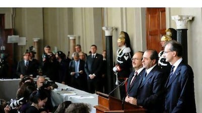 Leader of IDV, Antonio Di Pietro (2-R), speaks Sunday after consultations with the new Italian government after the resignation of Premier Silvio Berlusconi. He resigned after parliament gave final approval to austerity measures demanded by the European Union.
