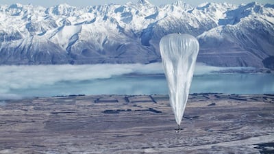 A Google Project Loon balloon sails through the air with the Southern Alps in the background, in Tekapo, New Zealand. Google' is experimenting with new ways to offer internet access. Jon Shenk / AP