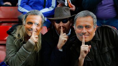 Chelsea fans wearing Jose Mourinho masks are seen prior to the Premier League match against Stoke at the Britannia Stadium on Saturday. Laurence Griffiths / Getty Images