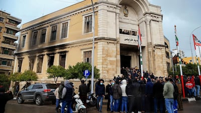 People gather in solidarity with the municipality of Tripoli after it was set on fire on Thursday night by demonstrators protesting the deteriorating economic situation. EPA
